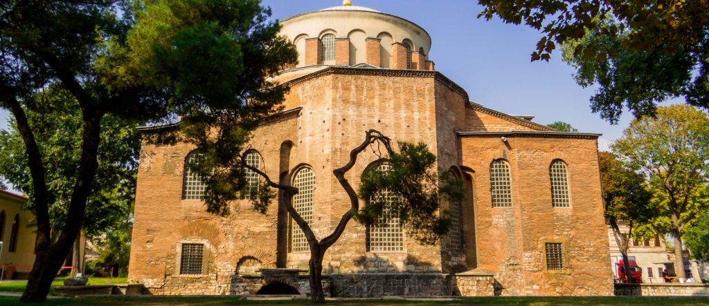 The majestic interior of Hagia Irene at Topkapi Palace, showcasing its vast, unadorned Byzantine nave and soaring dome.