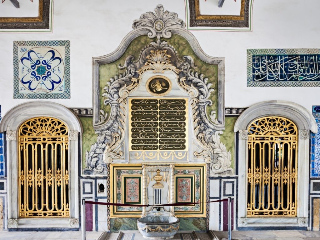 The magnificent Fountain of the Privy Chamber, a centerpiece of the Holy Relics section at Topkapi Palace, blending Ottoman Baroque marblework, intricate golden gates, and sacred calligraphy.