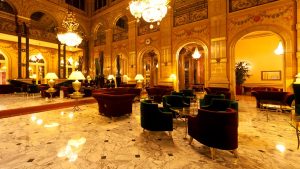 Super Hotel The opulent lobby of a luxury hotel in Istanbul, offering an elegant retreat with magnificent chandeliers and marble floors for discerning travelers.